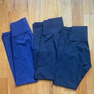 3 pairs of Lululemon high times luxtreme leggings: 1 navy, 2 black